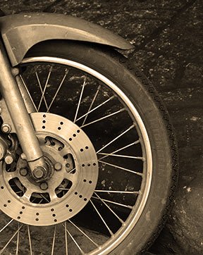 Close-up photo of a motorcycle wheel and brake disc